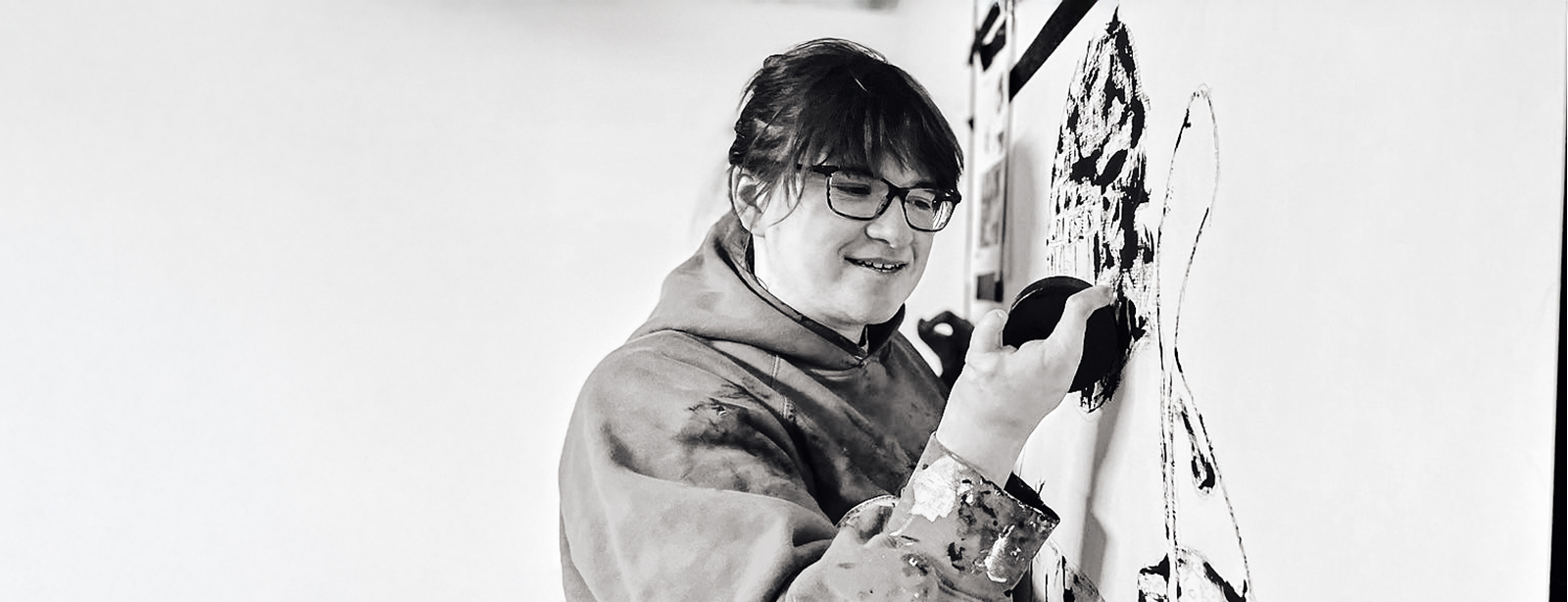 Samantha Woj, painting with a hockey puck