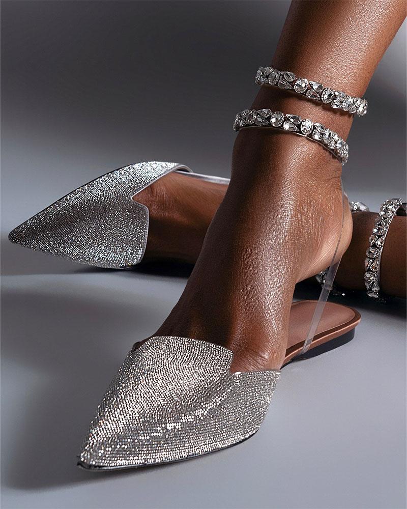 Woman showcasing glitter shoes
